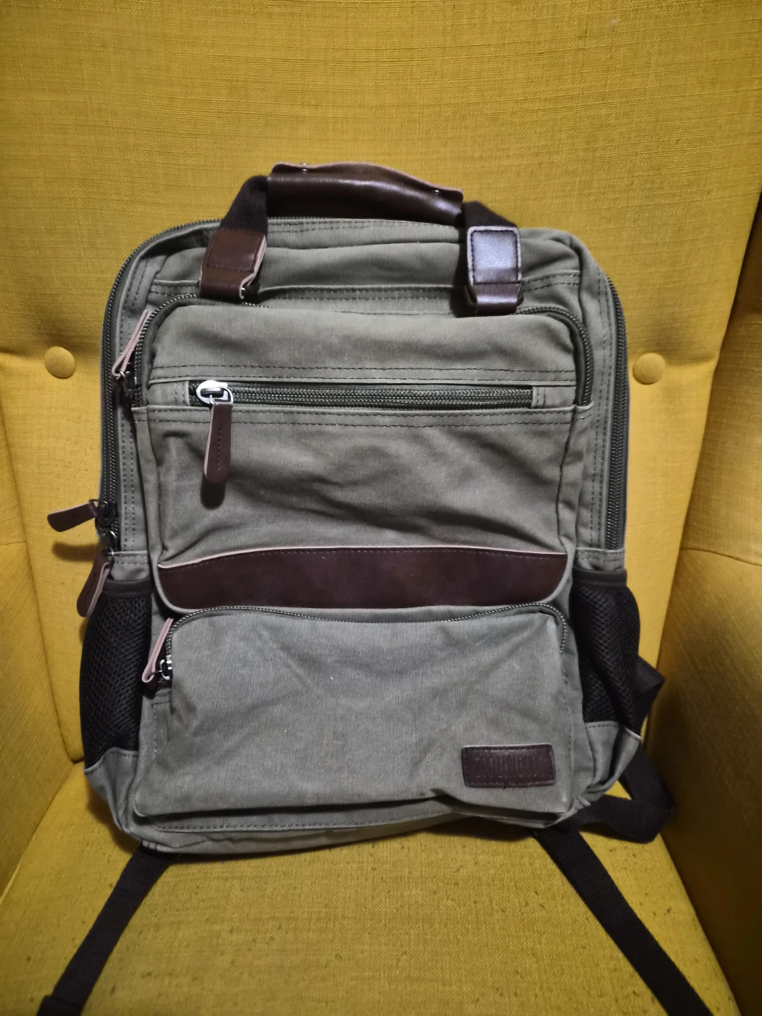 Canvas backpack with leather accents