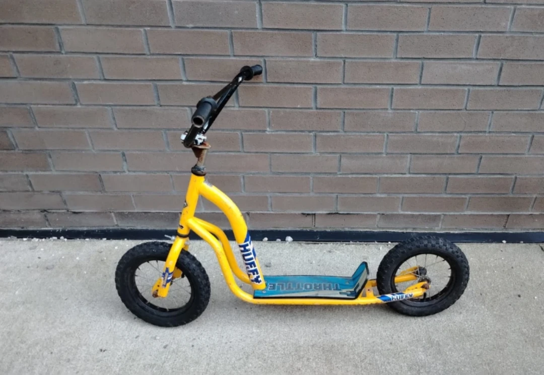 Yellow Huffy Throttle Scooter