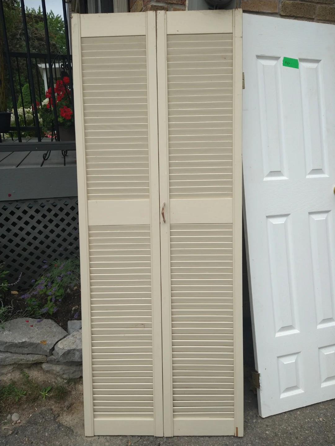 Cream coloured louvered bi-fold doors