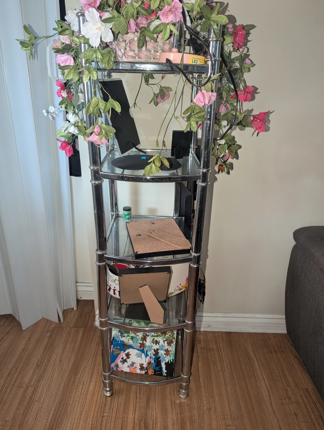 Chrome and Glass Shelf Unit with Artificial Flowers