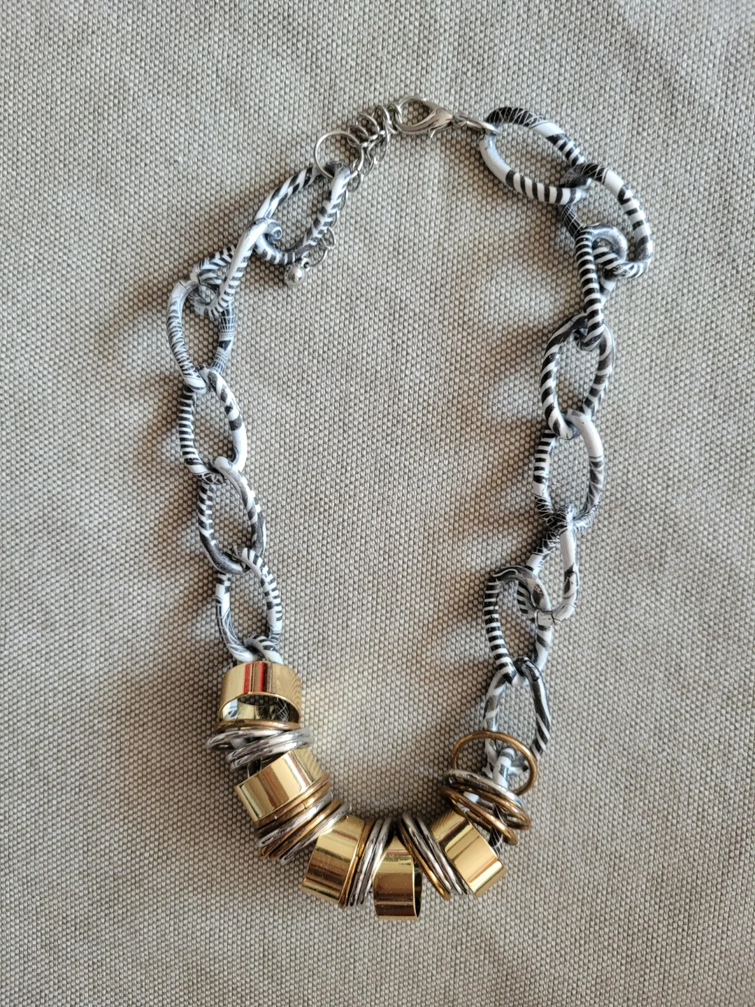 Statement Necklace with Black and White Pattern and Gold Accents