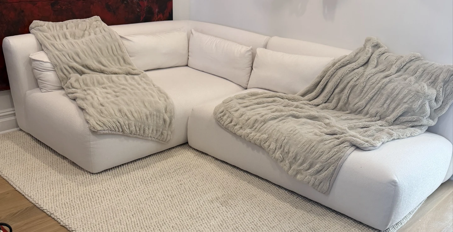 White Sectional Sofa with Textured Throws