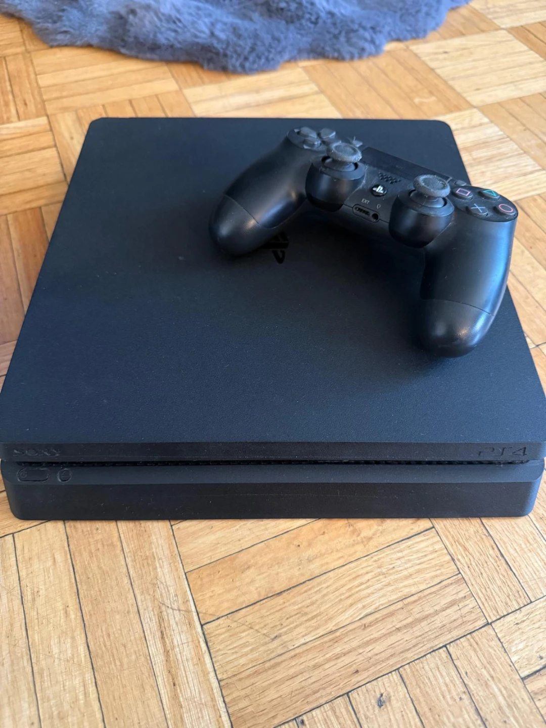 Sony PlayStation 4 Slim Console with Controller and Games