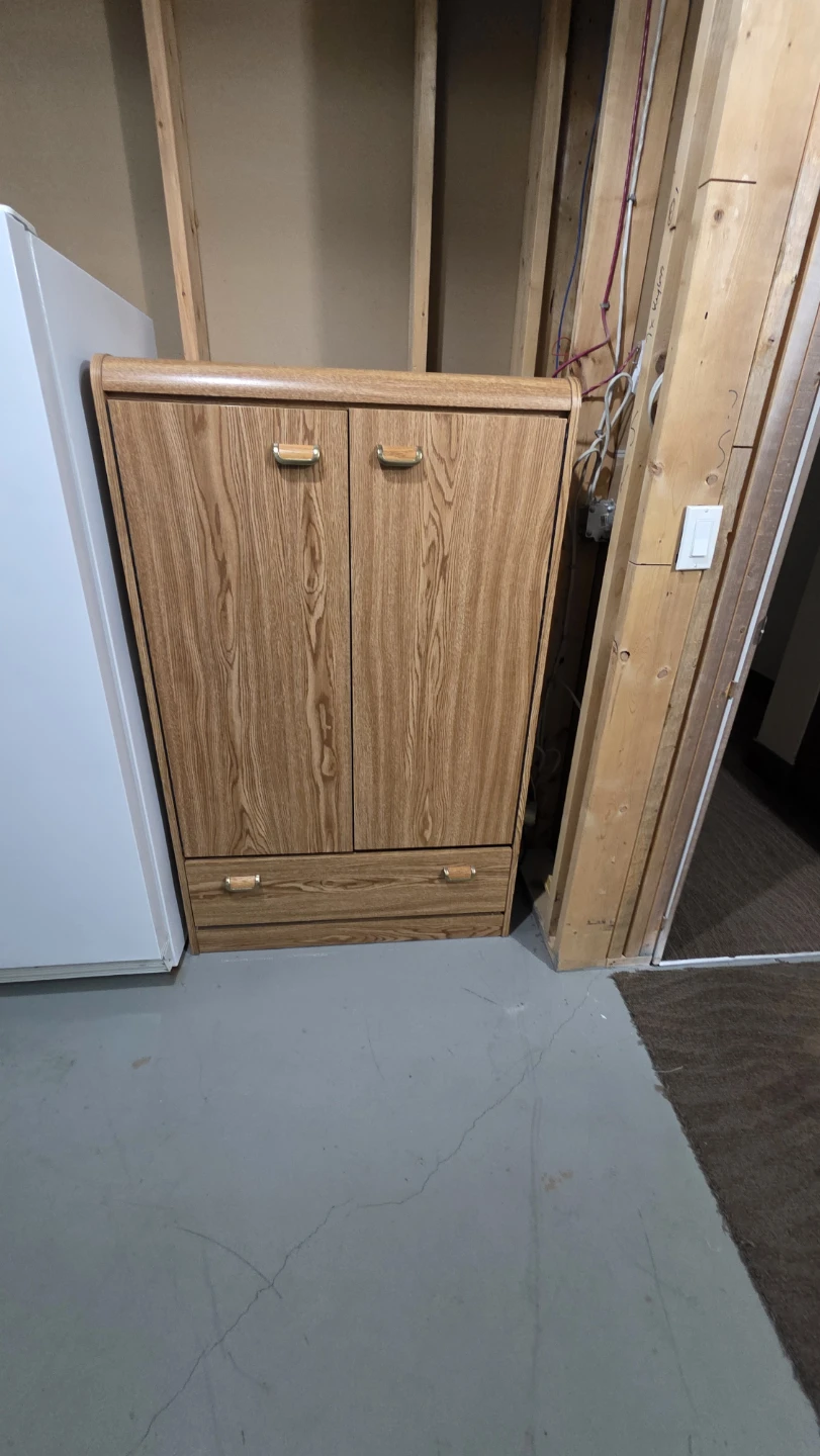 Oak Finish Cabinet with Shelves and Drawers