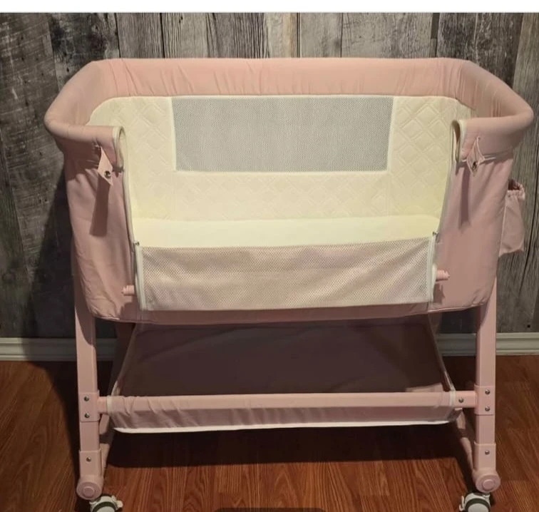 Pink Baby Bassinet with changing table and storage