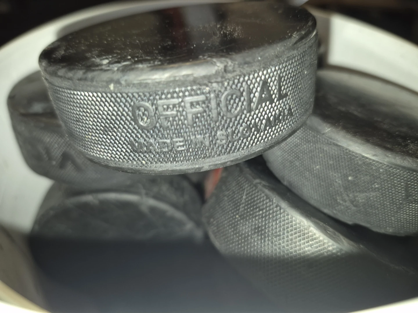 Pail of Hockey Pucks