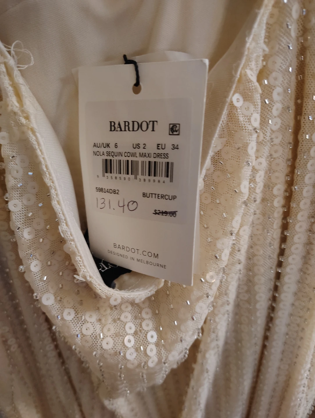 Elegant woman's cream color gown from Norstroms