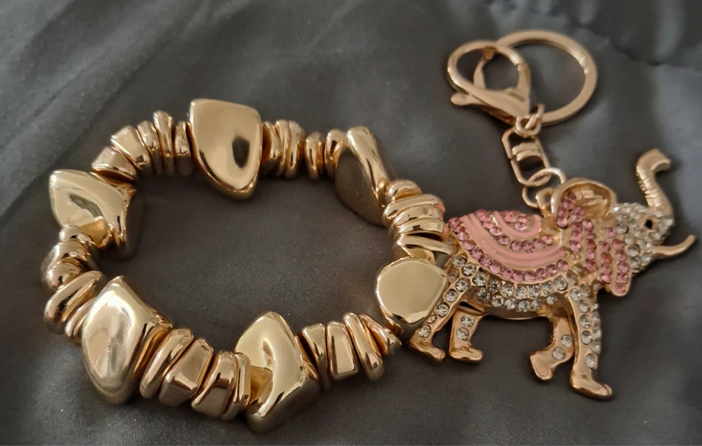 Gold-tone elephant keychain/stretchy brCeley