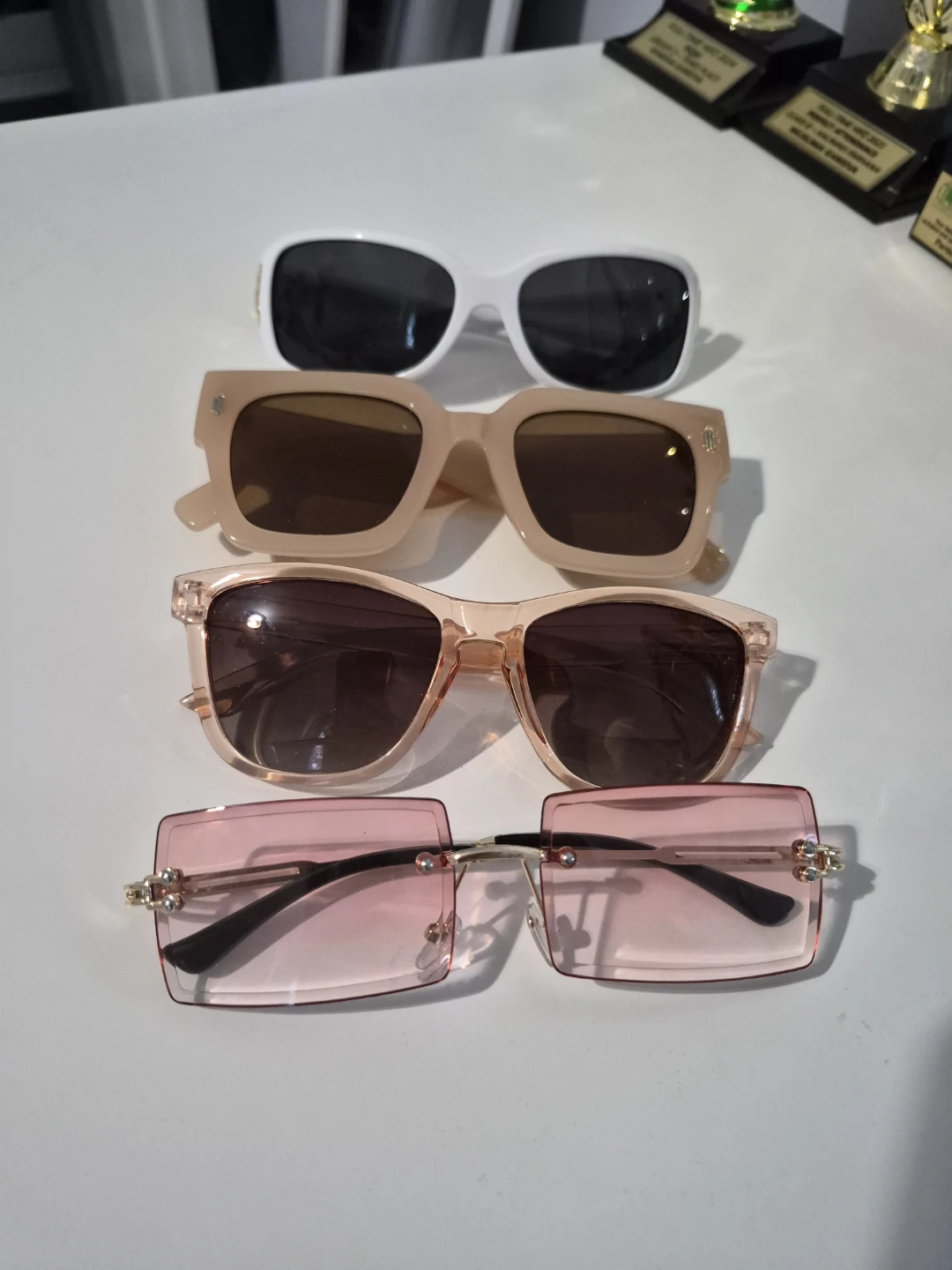 Four Pairs of Sunglasses