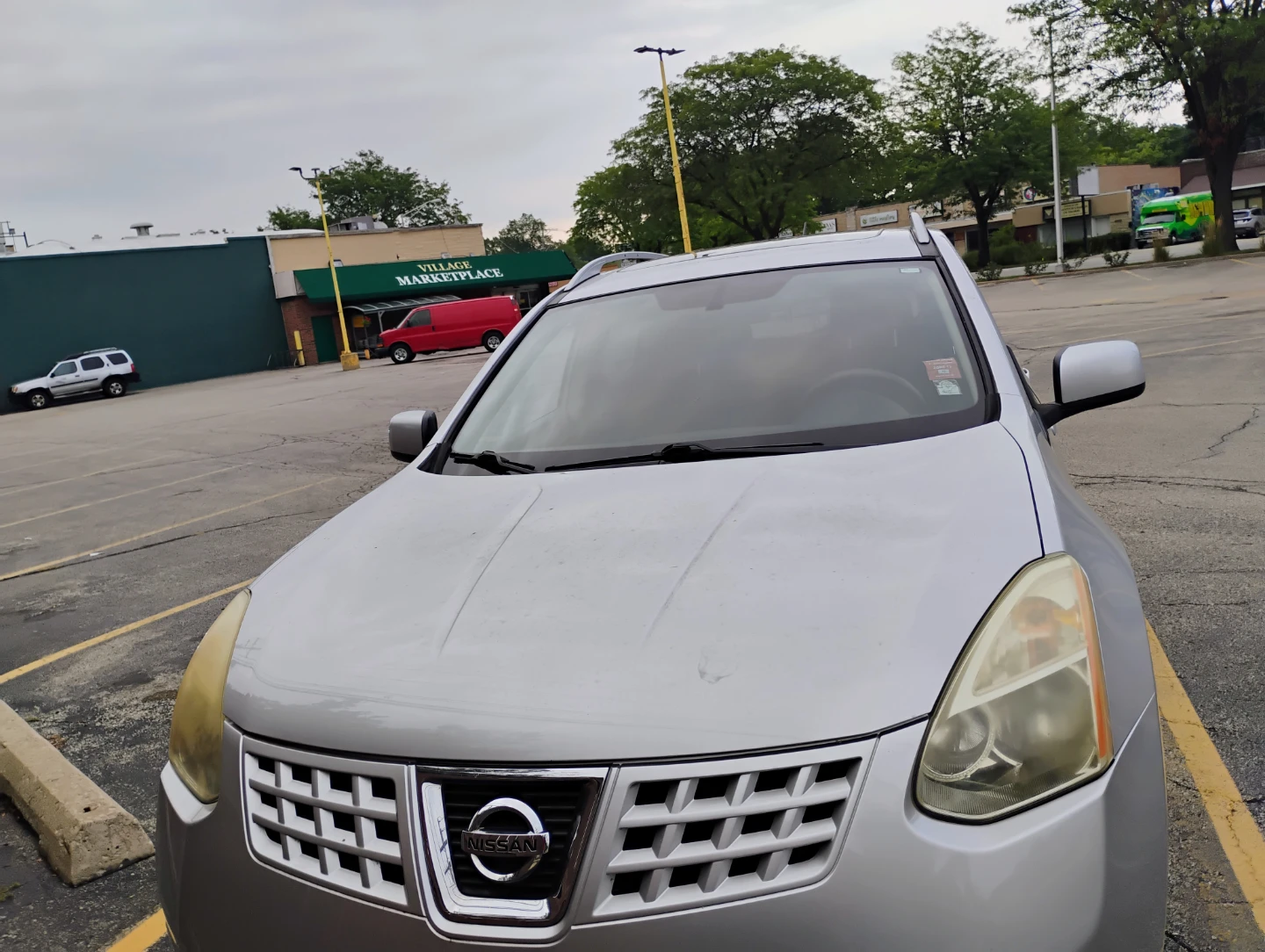 Silver Nissan Rogue SUV - photo 3