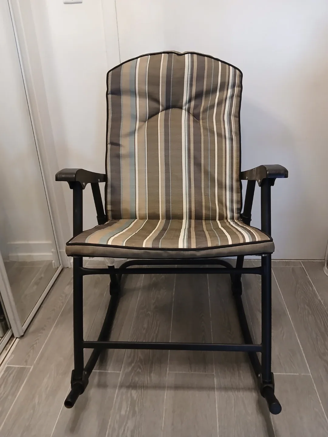 Folding Rocking Chair with Striped Cushion.