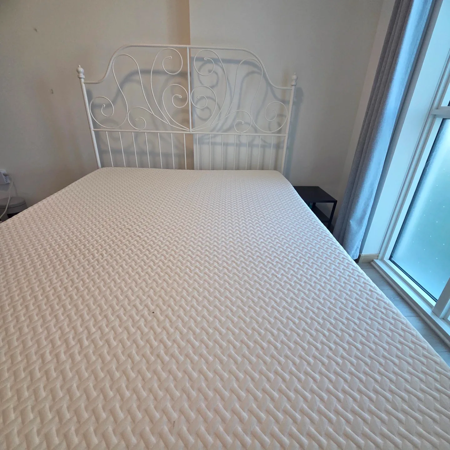White metal bed with queen mattress