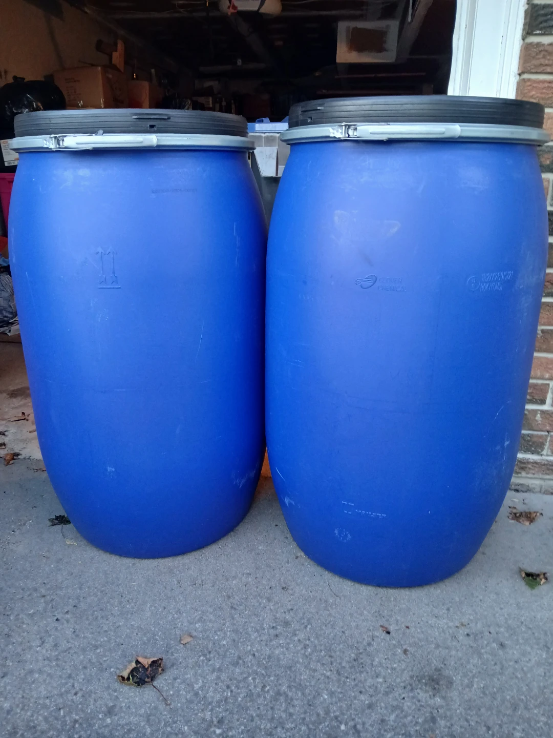 2 Blue Plastic Barrels