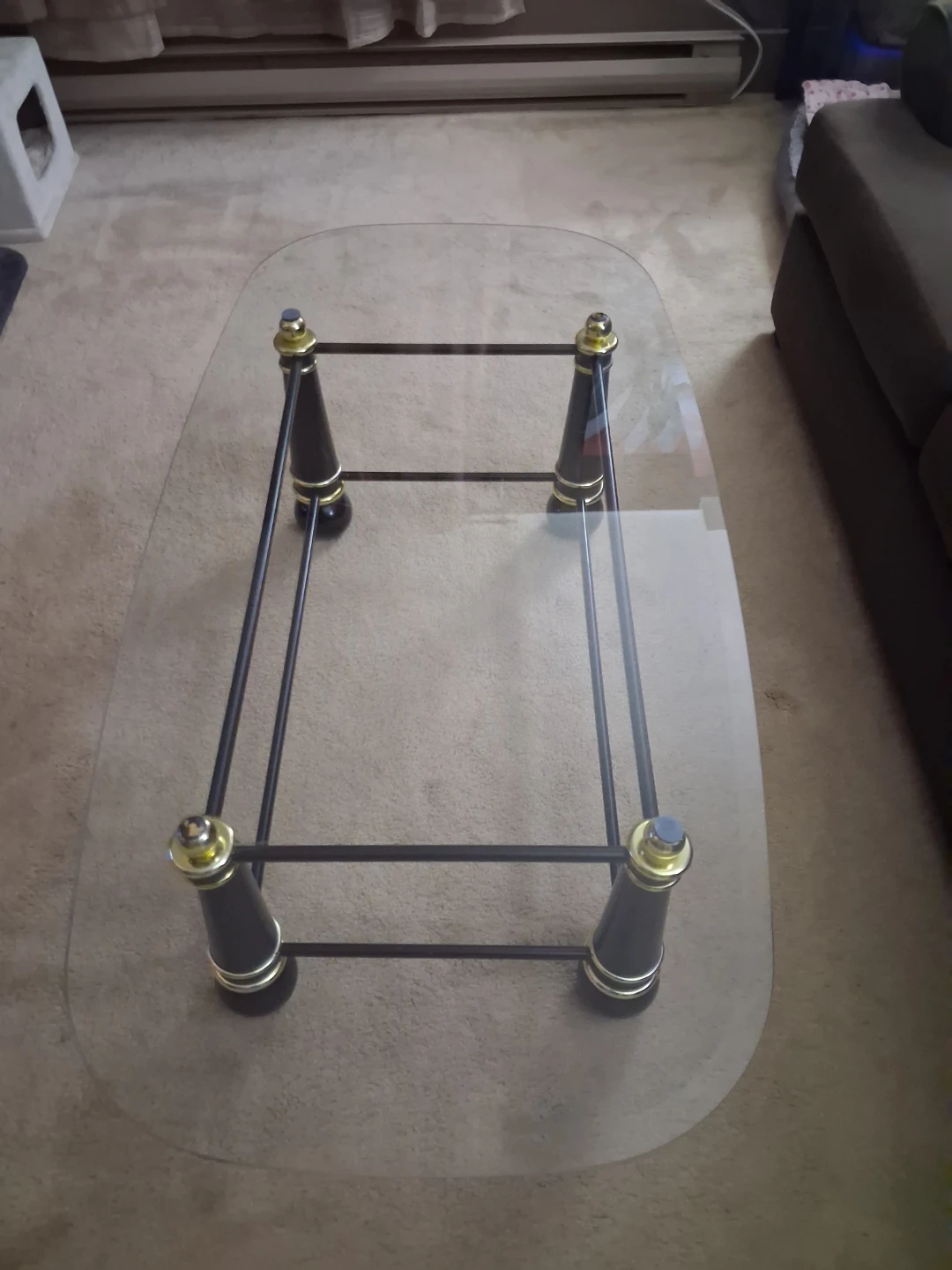 Glass top coffee table with metal frame