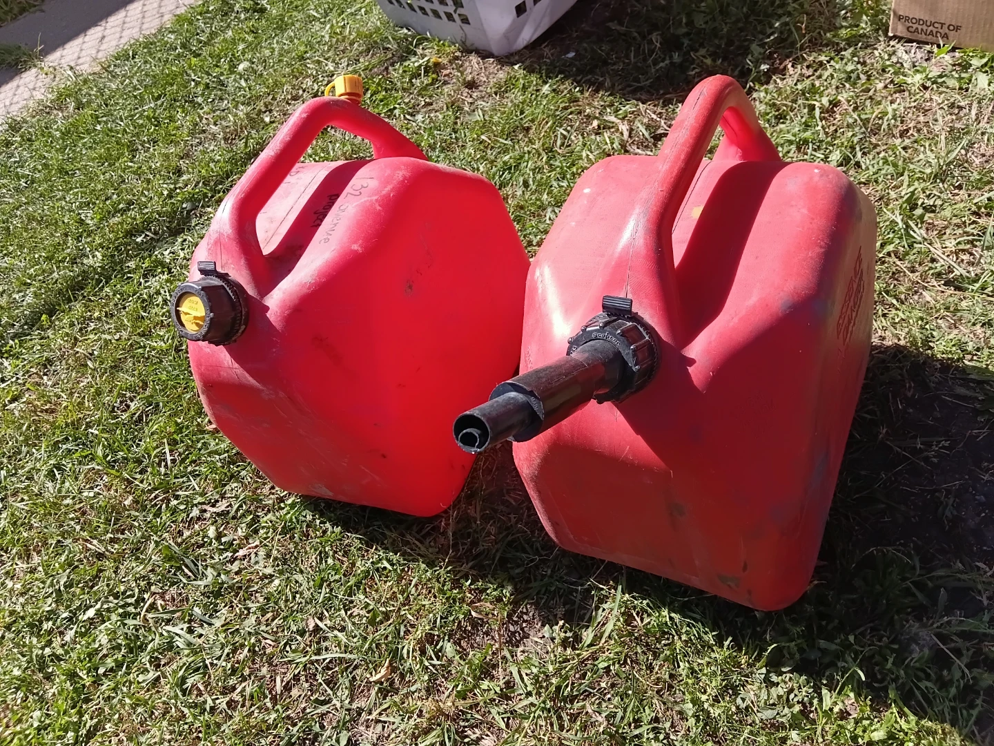 Two red plastic gas cans - photo 2