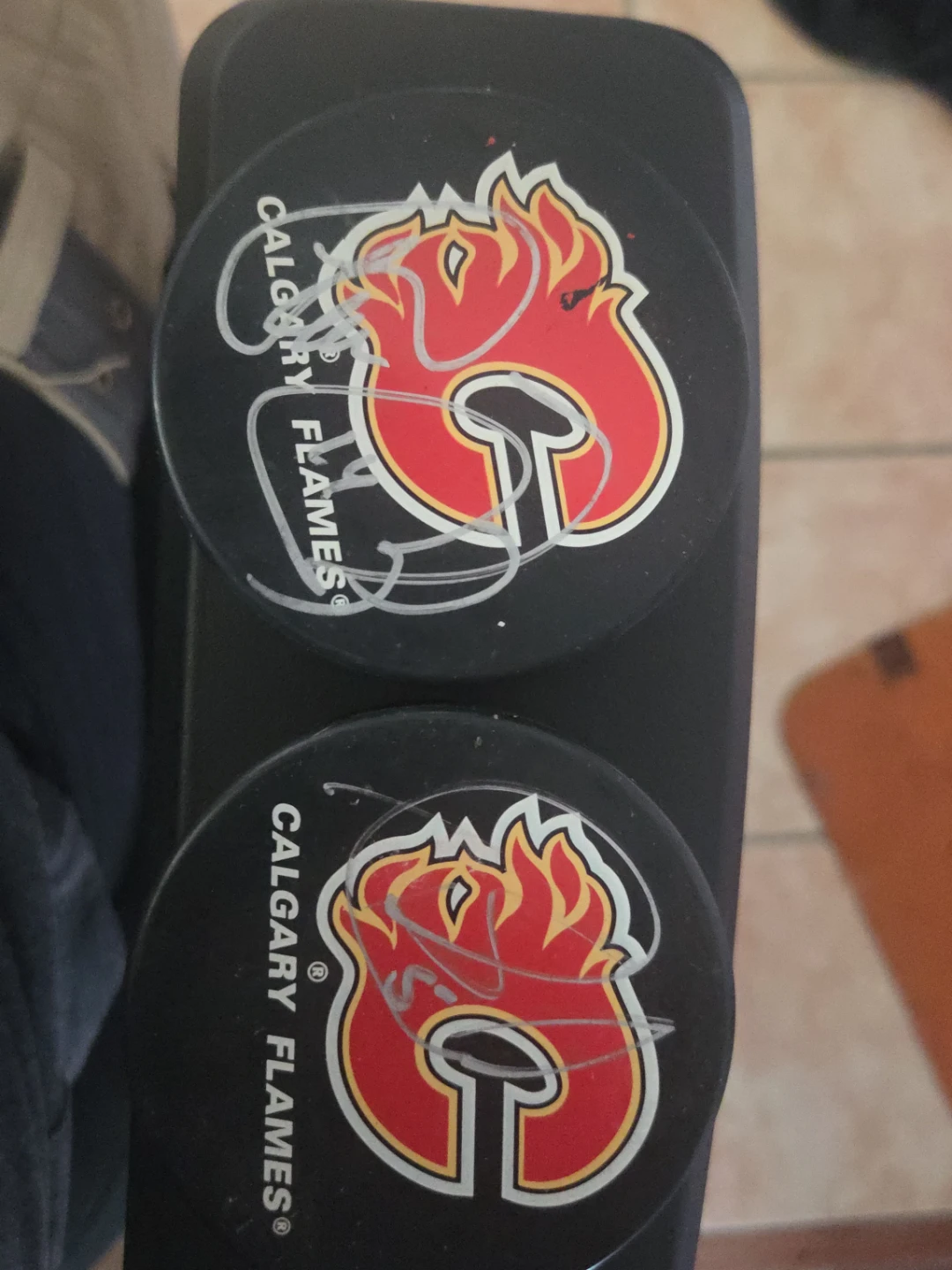 Calgary Flames Signed Hockey Pucks (2)