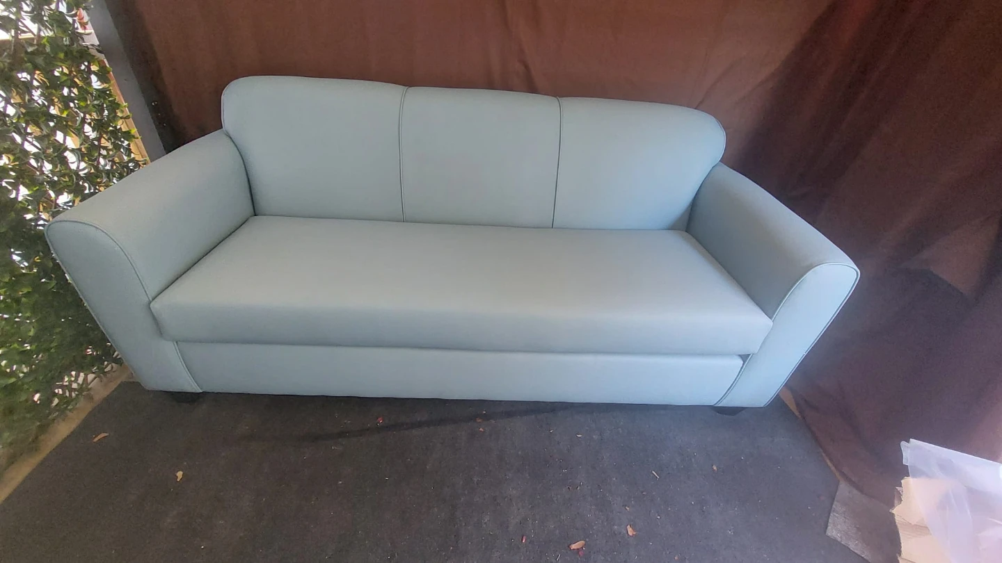 Never used faux leather sofa