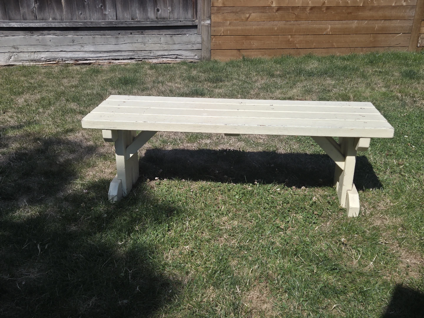 Cream coloured wooden bench