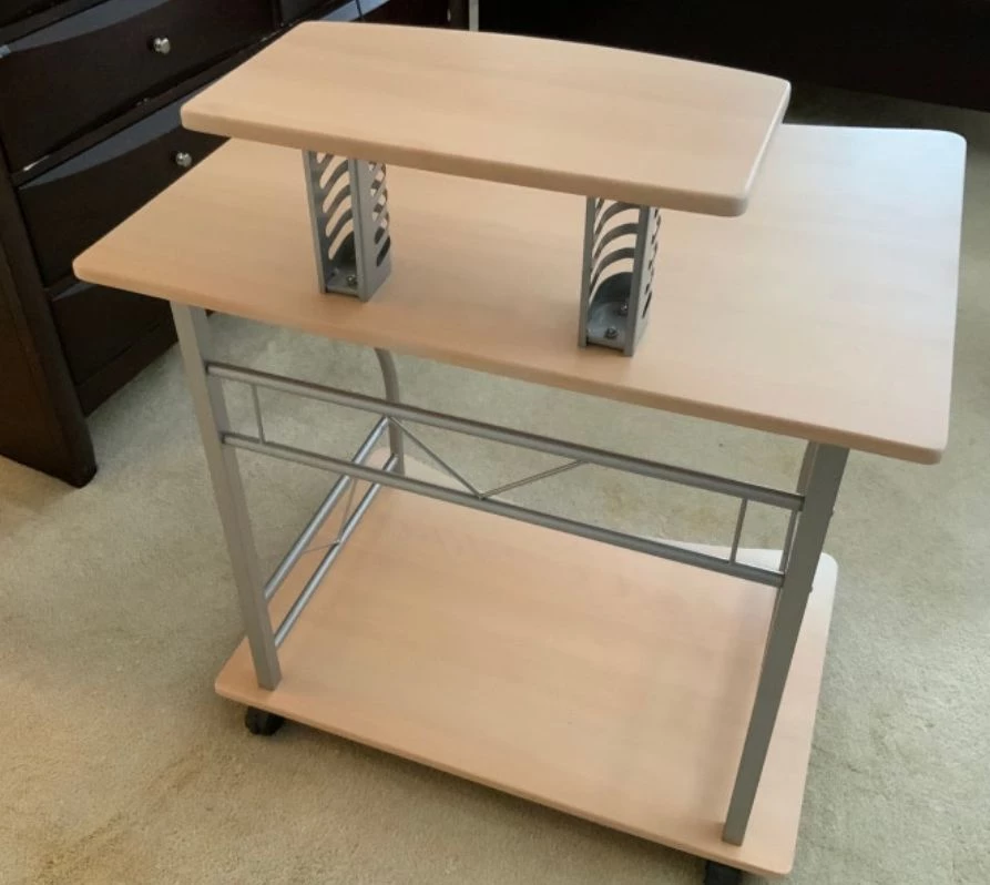 Compact computer desk features a sleek, light wood-grain - photo 2