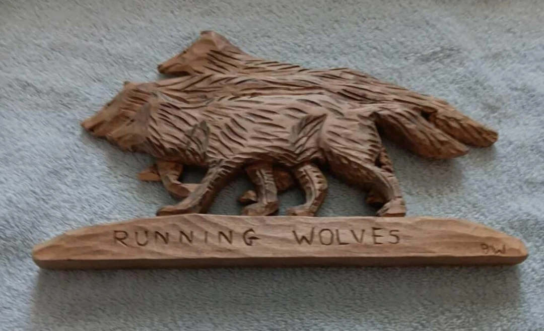 Hand-carved Running Wolves Wood Sculpture