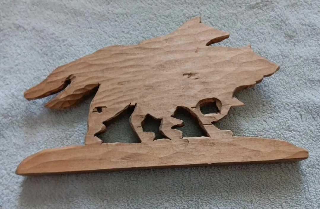 Hand-carved Running Wolves Wood Sculpture - photo 2