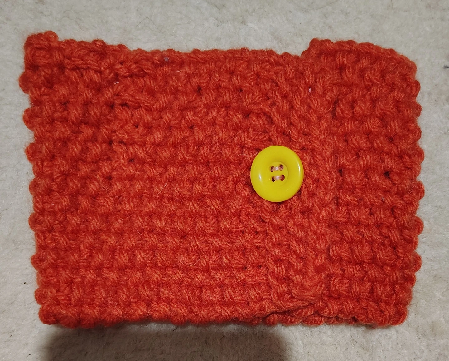 Orange Crocheted Coffee Cup Sleeve with Yellow Button