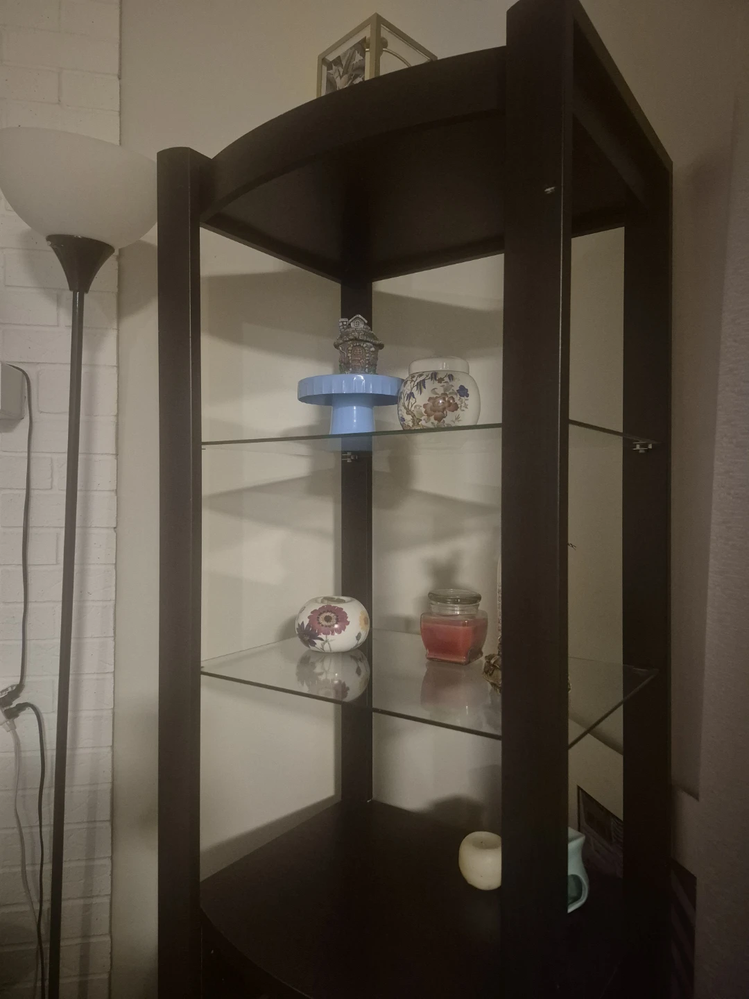 Dark brown wooden shelf with glass inserts