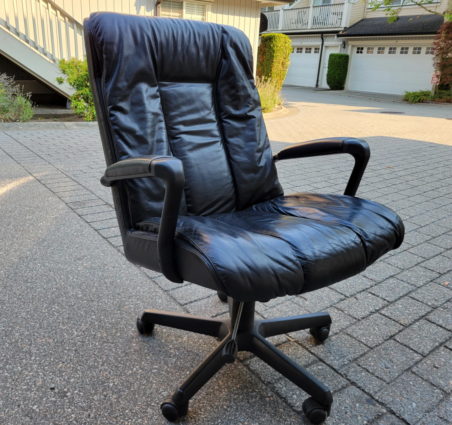 High-Back Ergonomic Black Leather Executive Office Chair.