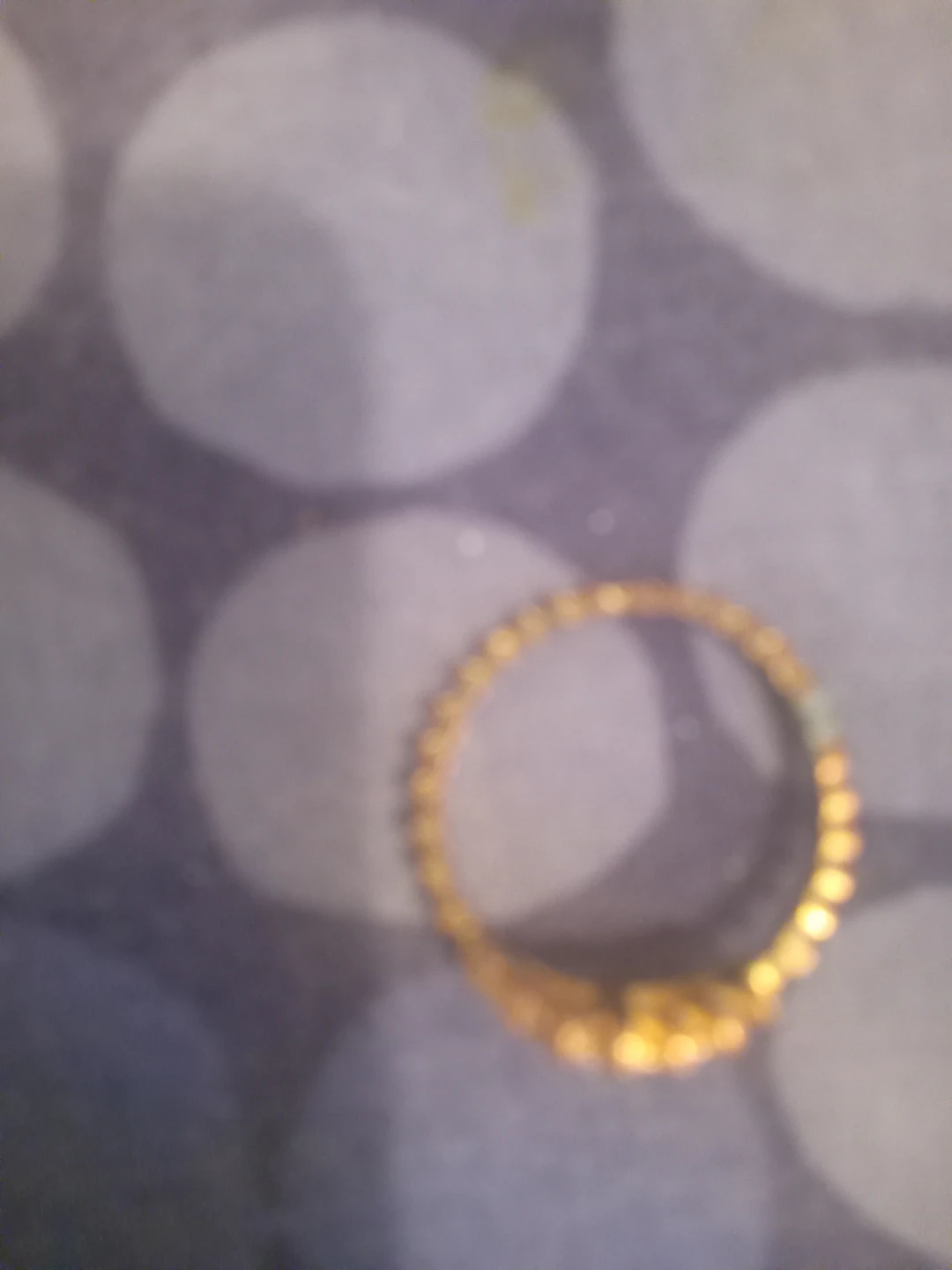 Gold tone ring with small stones