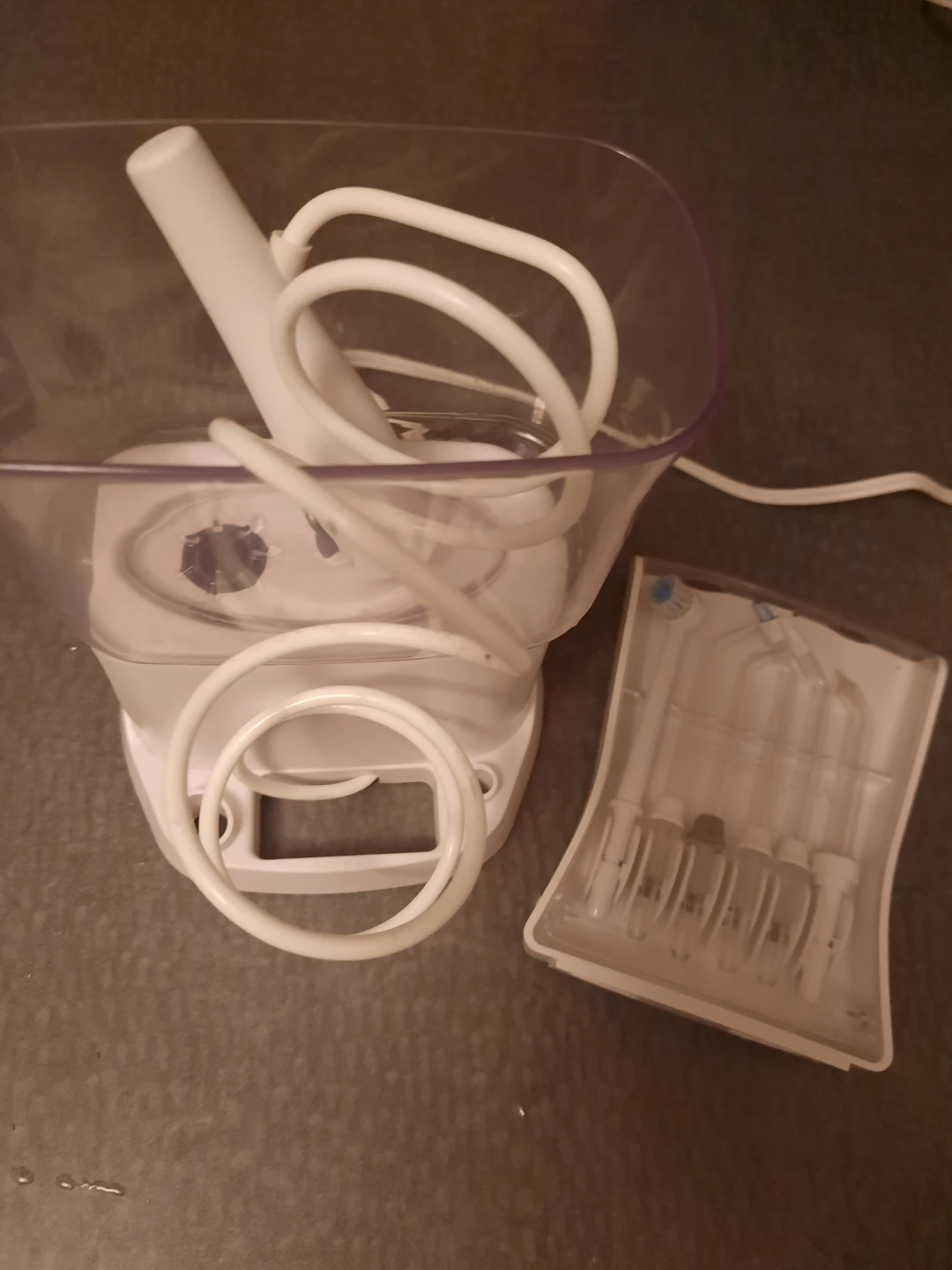 White Waterpik Flosser with Multiple Tips