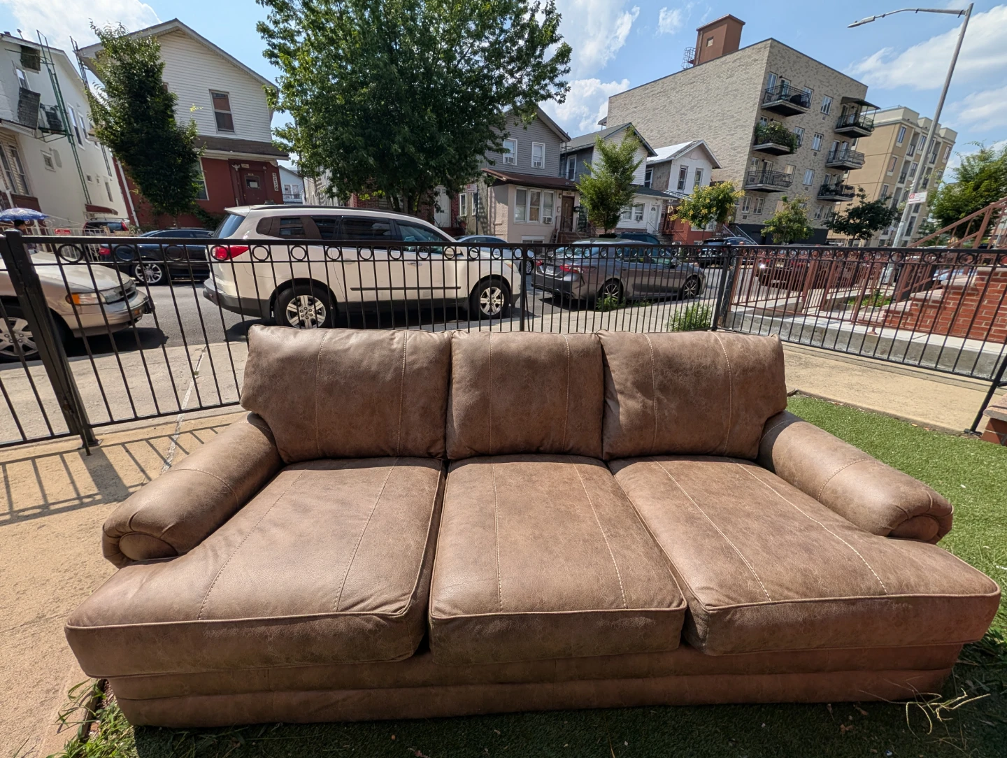 Tan full-size faux leather microfiber sofa