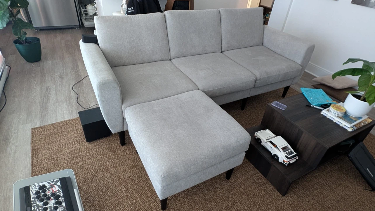 Light grey modular 3-seater sofa with movable ottoman