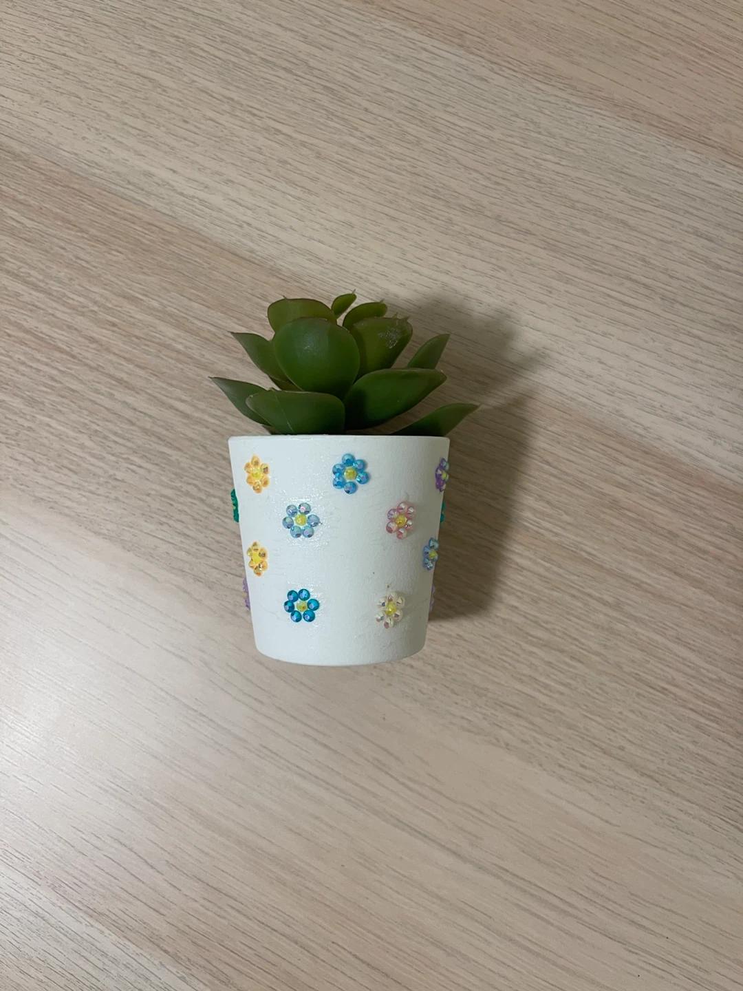 artificial succulent in bedazzled flower pot