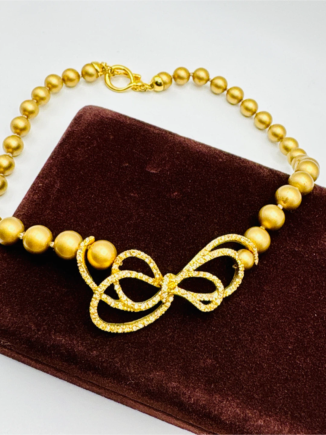 Carolee pearl necklace with rhinestone bow