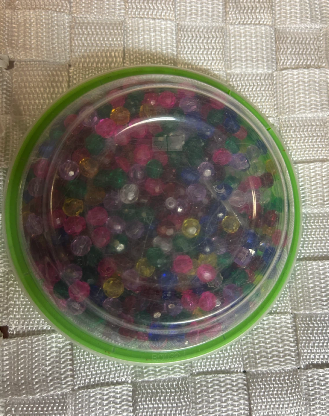 Container with colourful beads