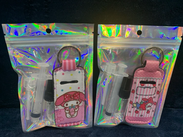 My Melody & Kuromi Lip Gloss/Spray bottle Holder Keychain Set