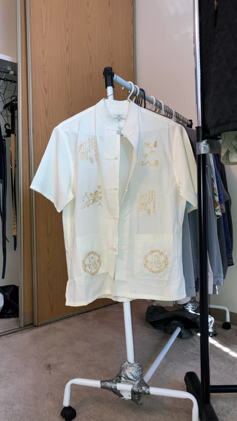 A classy, gold embroidered Chinese shirt, size small.