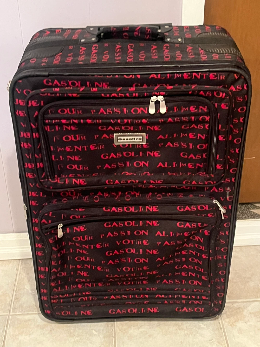 Gasoline black and red patterned rolling suitcase