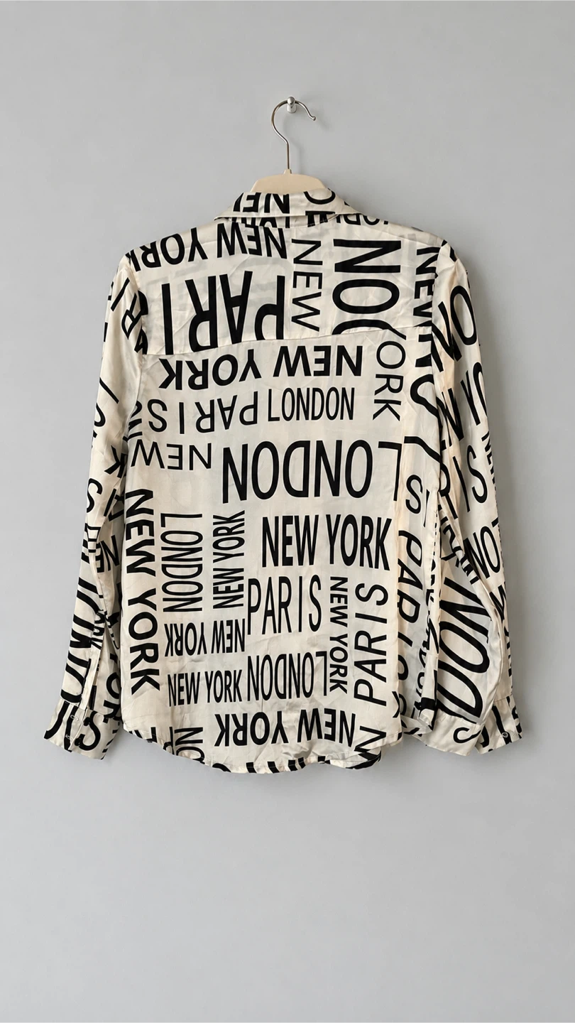 White & Black Text Print Button-Up Shirt - photo 5