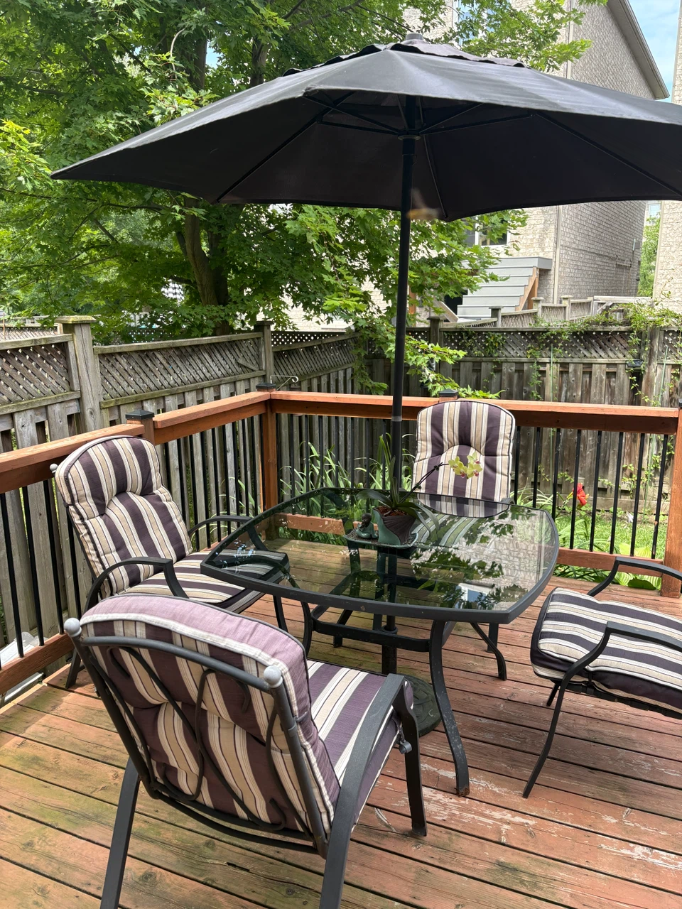 Glass Top Patio Table Set with Umbrella and Cushioned Chairs - photo 2