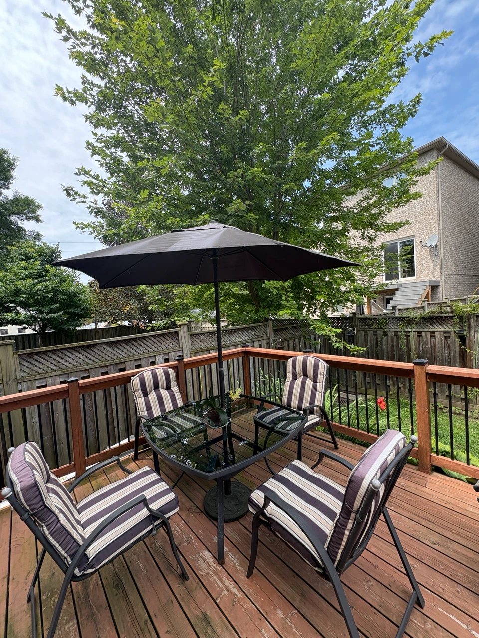 Glass Top Patio Table Set with Umbrella and Cushioned Chairs - photo 4