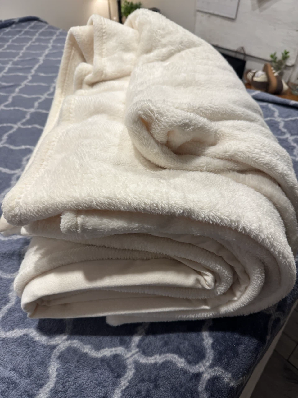 Cream coloured plush throw blanket