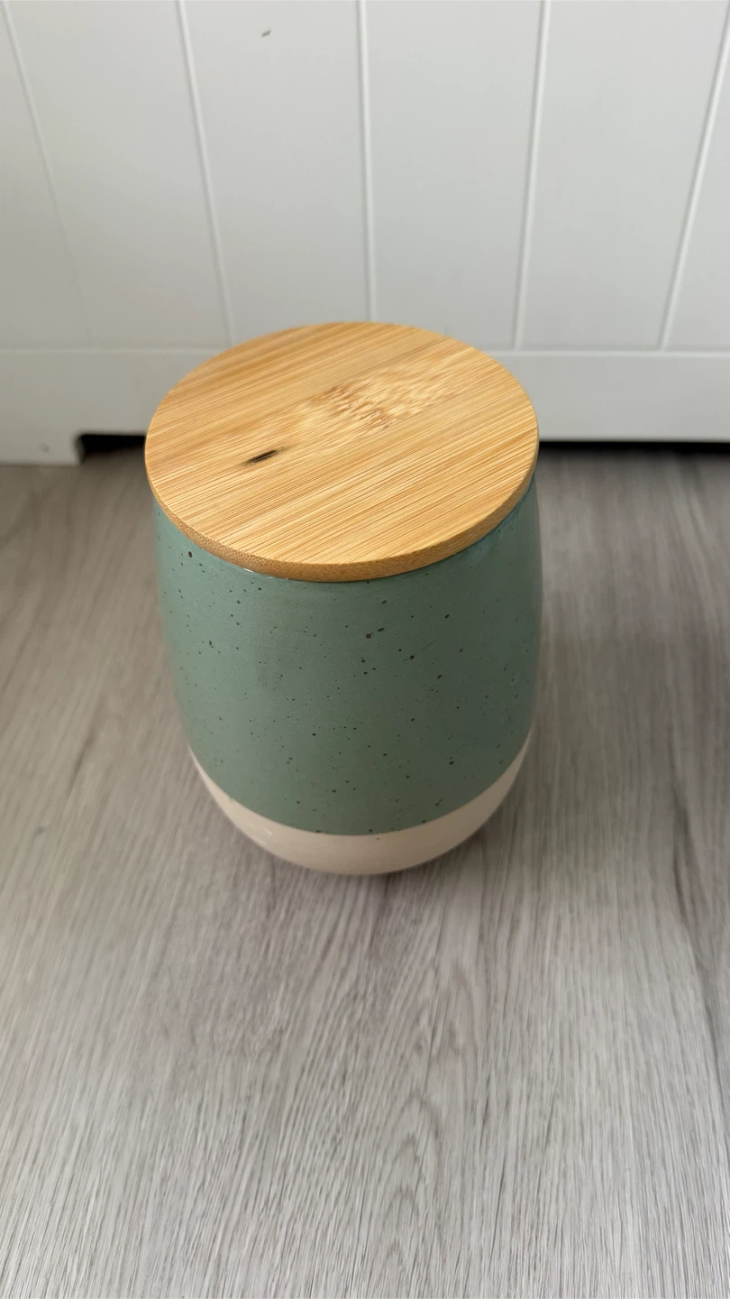 Sage green ceramic storage jar