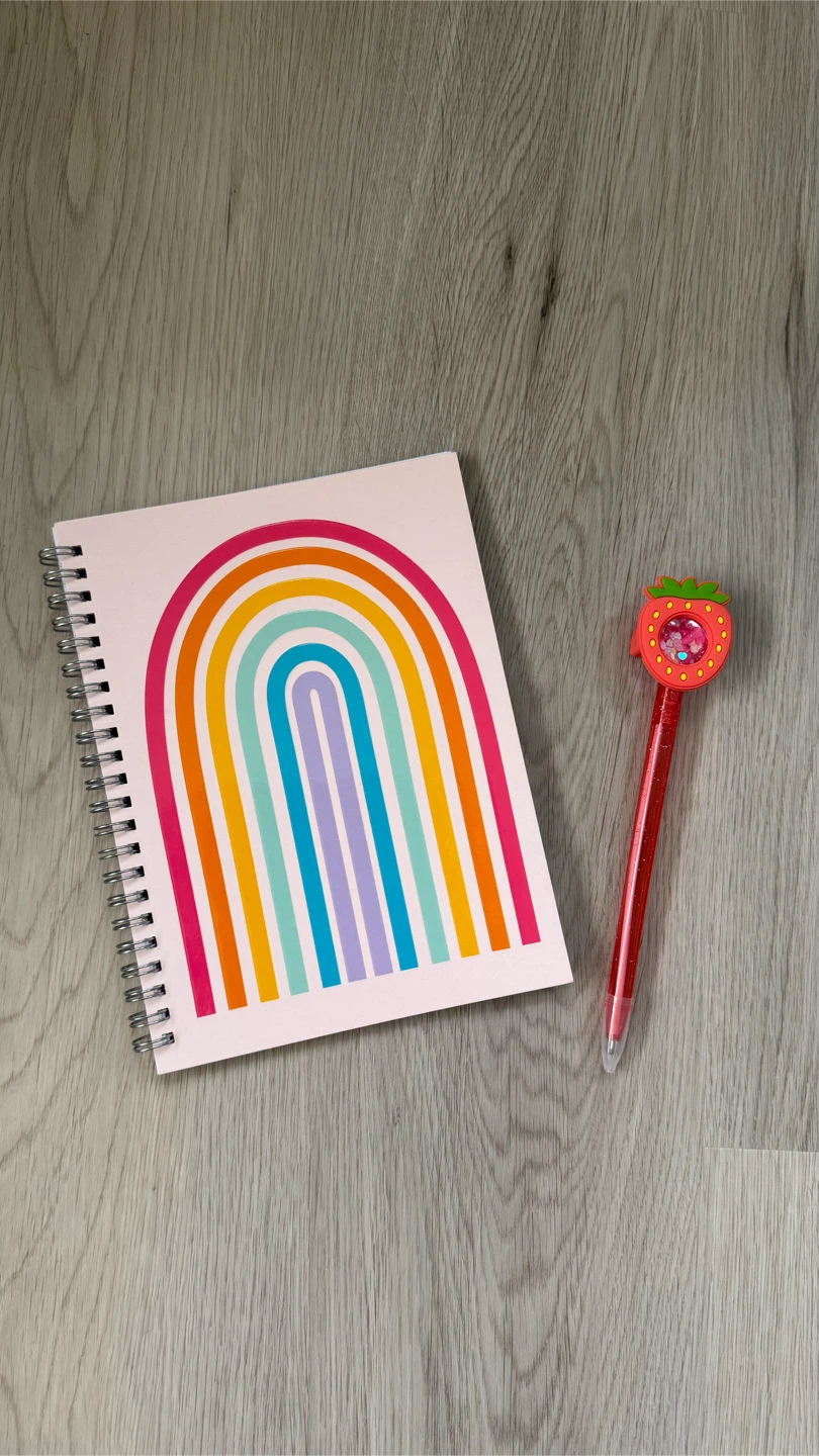 Brand new rainbow notebook and confetti filled strawberry pen