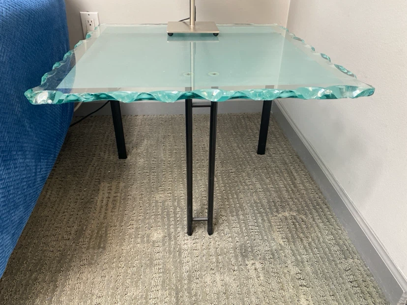 Glass top side table with metal legs