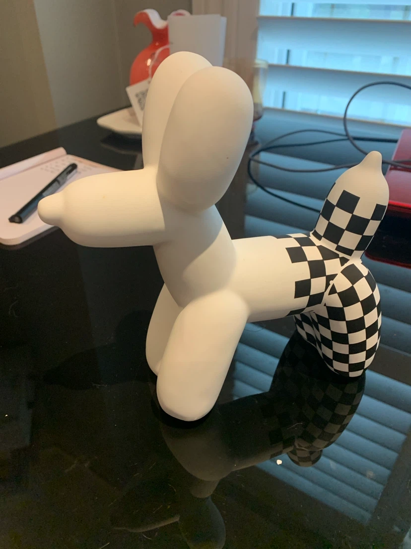 White Balloon Dog Sculpture with Checkered Tail
