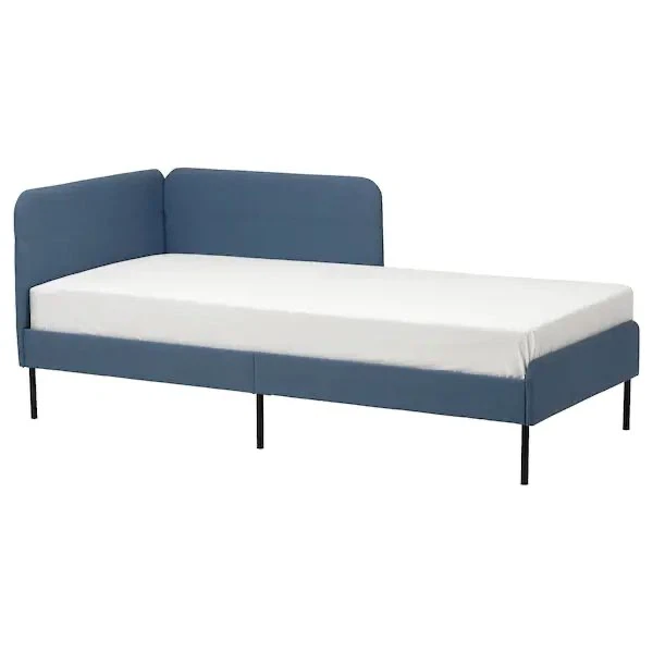 Blue upholstered daybed with corner headboard