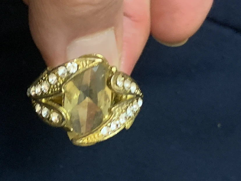 Gold tone ring with clear and yellow stones