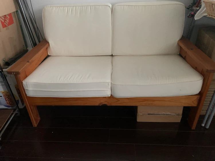 Wooden Loveseat with Cream Cushions