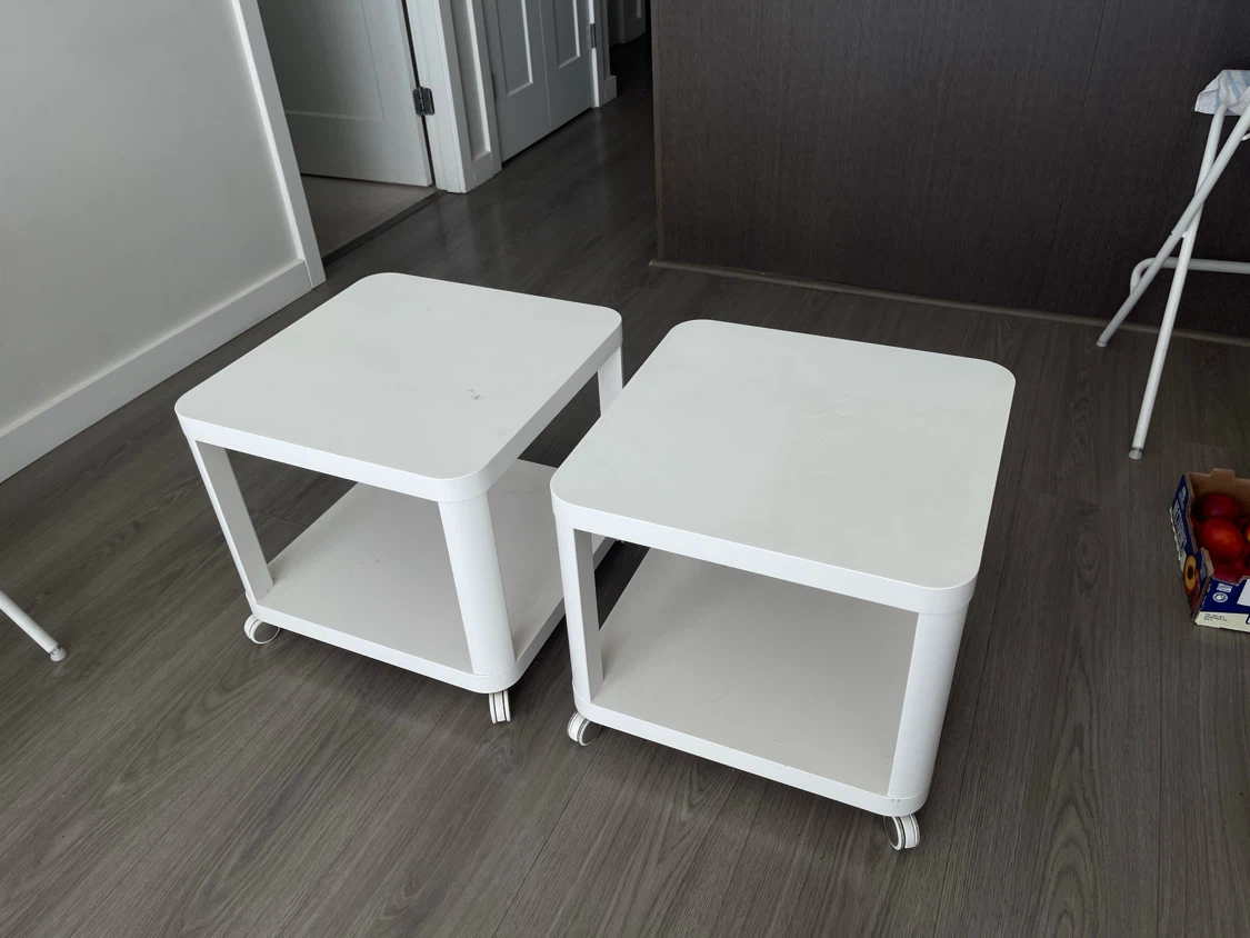 Two White Side Tables with Wheels